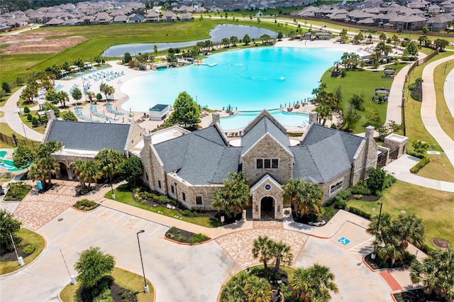12206 English Mist Dr, Houston, TX 77044 - aerial view of residential area featuring a pool and a large body of water