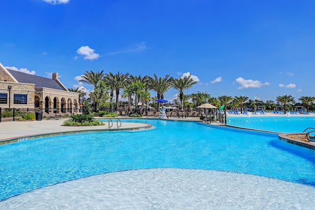 12206 English Mist Dr, Houston, TX 77044 - community pool with a patio area and fence