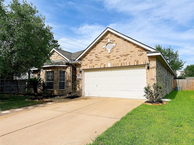 16322 E Amber Willow Trl, Cypress, TX 77433 - ranch-style house featuring an attached garage, concrete driveway, and brick siding