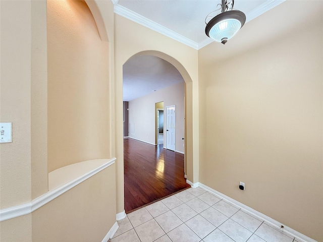 16322 E Amber Willow Trl, Cypress, TX 77433 - corridor featuring arched walkways, crown molding, light tile patterned floors, and baseboards