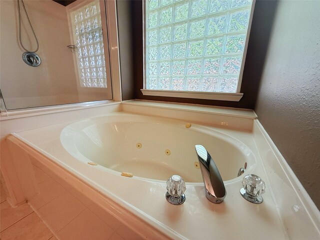 16322 E Amber Willow Trl, Cypress, TX 77433 - bathroom featuring a whirlpool tub and a textured wall