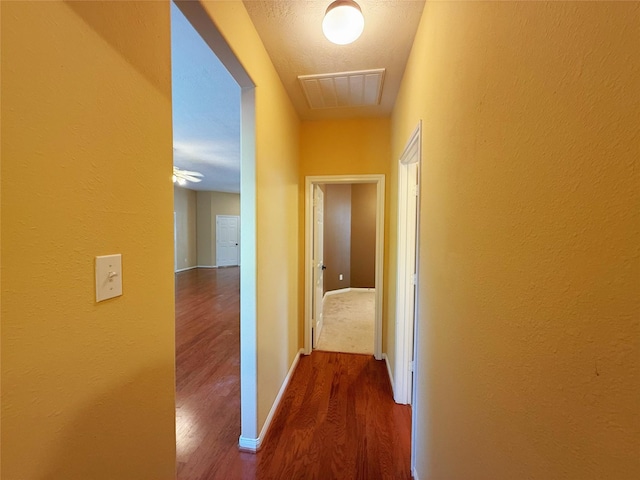 16322 E Amber Willow Trl, Cypress, TX 77433 - hallway featuring wood finished floors, baseboards, and a textured wall