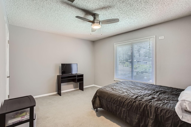 15335 Poplar Grove Dr, Houston, TX 77068 - bedroom with light colored carpet, a textured ceiling, ceiling fan, and baseboards