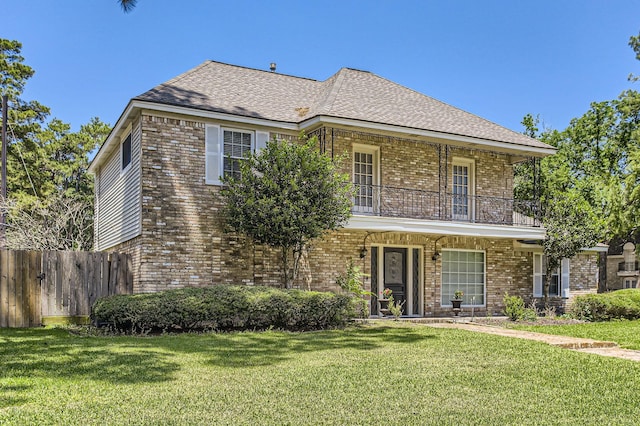 15335 Poplar Grove Dr, Houston, TX 77068 - view of front of home with a balcony, brick siding, and a shingled roof