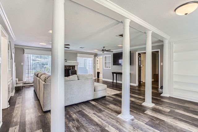 15335 Poplar Grove Dr, Houston, TX 77068 - living area featuring a ceiling fan, crown molding, baseboards, dark wood-style flooring, and a fireplace