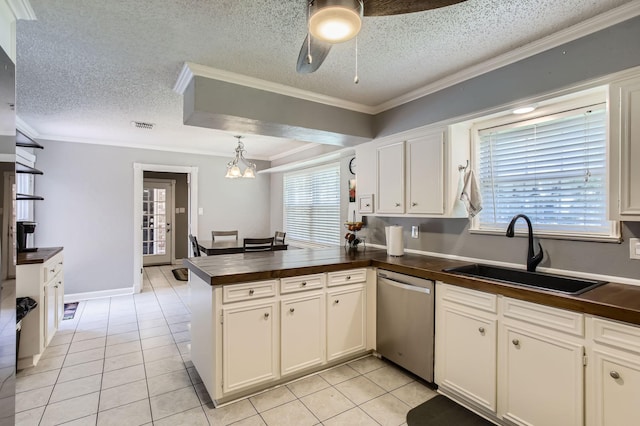 15335 Poplar Grove Dr, Houston, TX 77068 - kitchen with a sink, dishwasher, dark countertops, a peninsula, and crown molding