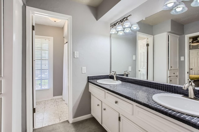 15335 Poplar Grove Dr, Houston, TX 77068 - full bath with baseboards and double vanity