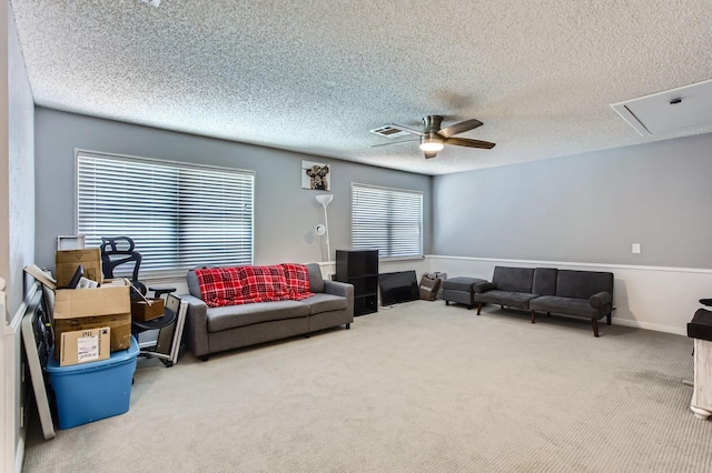 15335 Poplar Grove Dr, Houston, TX 77068 - living area featuring carpet flooring, ceiling fan, a textured ceiling, and attic access