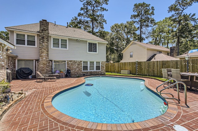 15335 Poplar Grove Dr, Houston, TX 77068 - view of pool featuring a patio area and a fenced backyard
