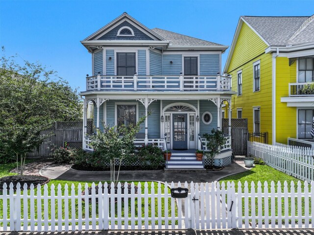 1515 24th St, Galveston, TX 77550 - victorian house featuring a balcony and covered porch