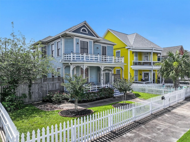 1515 24th St, Galveston, TX 77550 - victorian house featuring a balcony and covered porch