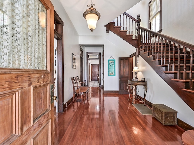 1515 24th St, Galveston, TX 77550 - foyer entrance with stairway, dark wood-style flooring, and baseboards