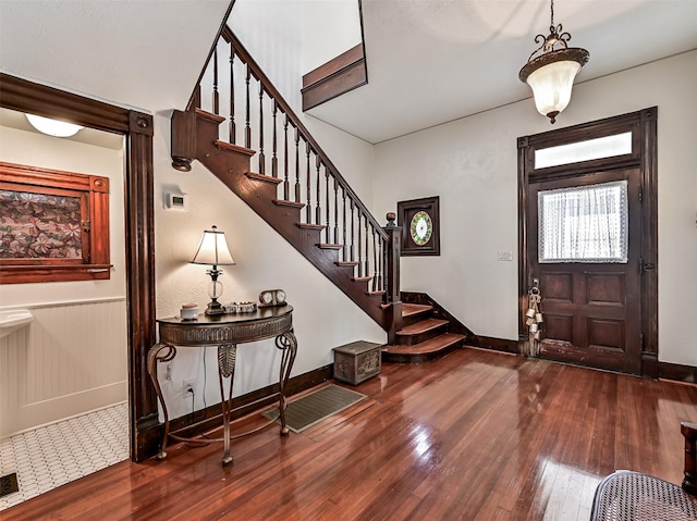 1515 24th St, Galveston, TX 77550 - foyer featuring hardwood / wood-style flooring, stairs, and baseboards