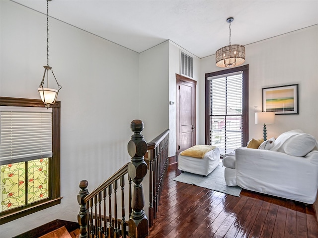 1515 24th St, Galveston, TX 77550 - bedroom with hardwood / wood-style flooring and a chandelier