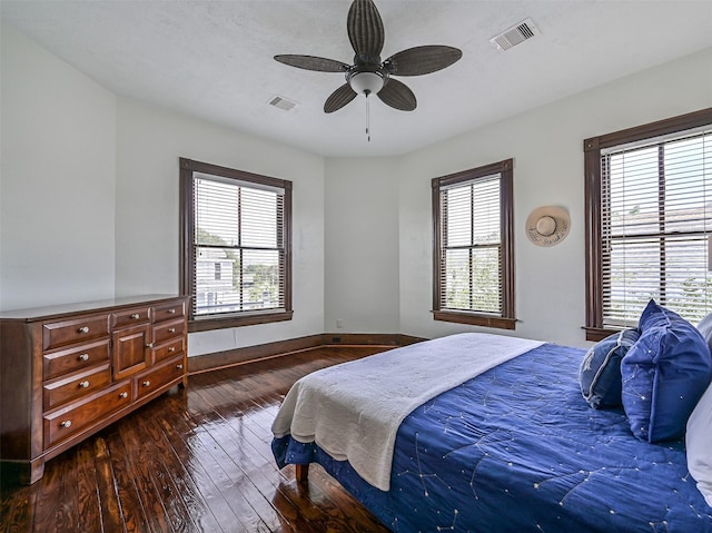 1515 24th St, Galveston, TX 77550 - bedroom featuring hardwood / wood-style floors, baseboards, and a ceiling fan