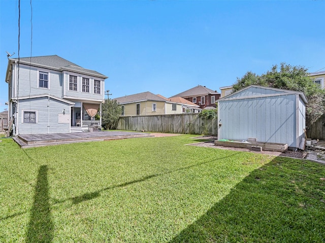1515 24th St, Galveston, TX 77550 - view of yard with a shed, an outdoor structure, a residential view, and a wooden deck