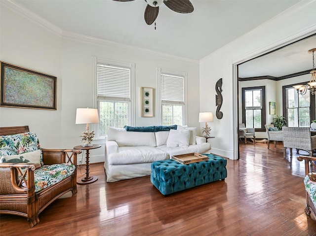 1515 24th St, Galveston, TX 77550 - living area featuring ornamental molding, a ceiling fan, baseboards, a chandelier, and wood finished floors