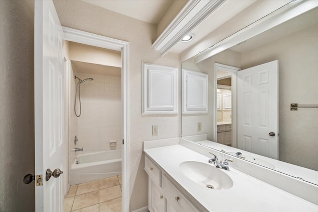 bathroom featuring vanity, tile patterned floors, bathing tub / shower combination, and baseboards