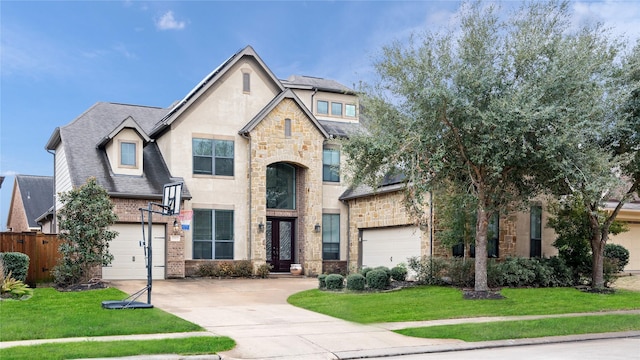 17803 Paint Bluff Ln, Cypress, TX 77433 - view of front of property featuring concrete driveway, stone siding, a garage, french doors, and roof with shingles