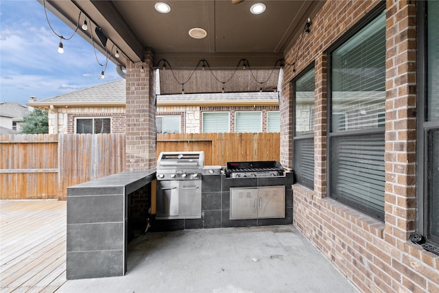 17803 Paint Bluff Ln, Cypress, TX 77433 - view of patio / terrace featuring exterior kitchen, fence, a grill, and a deck