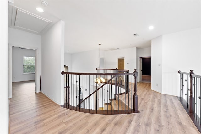 17803 Paint Bluff Ln, Cypress, TX 77433 - hall with an upstairs landing, light wood-style flooring, attic access, baseboards, and recessed lighting