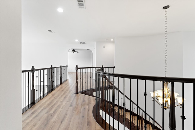 17803 Paint Bluff Ln, Cypress, TX 77433 - hall featuring light wood-type flooring, recessed lighting, an upstairs landing, and a chandelier