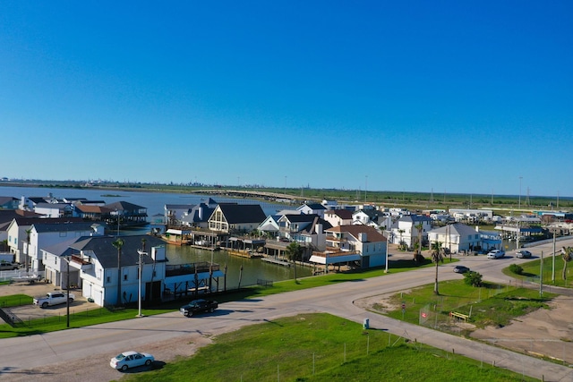 301 Commander Dr, Tiki Island, TX 77554 - aerial view of residential area with a large body of water