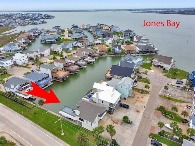 301 Commander Dr, Tiki Island, TX 77554 - aerial view of residential area featuring a nearby body of water