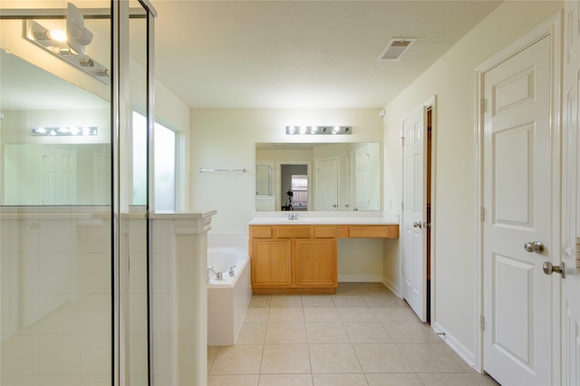 full bathroom with a garden tub, a stall shower, tile patterned floors, and vanity