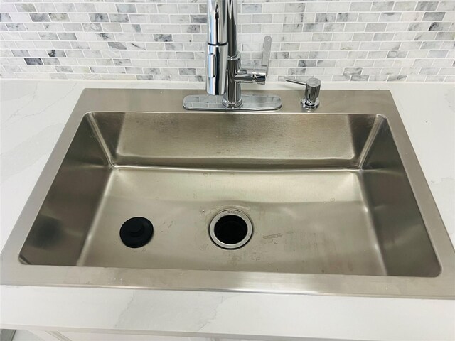 2668 Bering Dr Unit 2668, Houston, TX 77057 - kitchen view of a sink and decorative backsplash