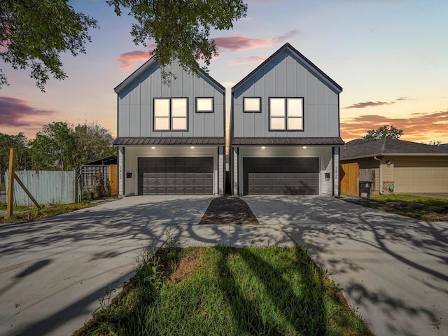 7812 Colonial Ln, Houston, TX 77051 - view of front of house featuring driveway, board and batten siding, a garage, fence, and metal roof