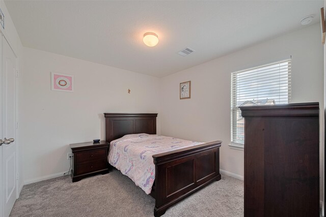6831 Beck Canyon Dr, Houston, TX 77084 - bedroom with light carpet and baseboards