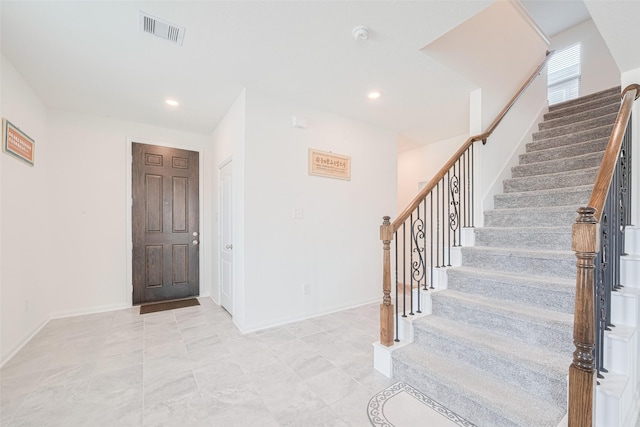 6831 Beck Canyon Dr, Houston, TX 77084 - entrance foyer featuring stairs, baseboards, and recessed lighting