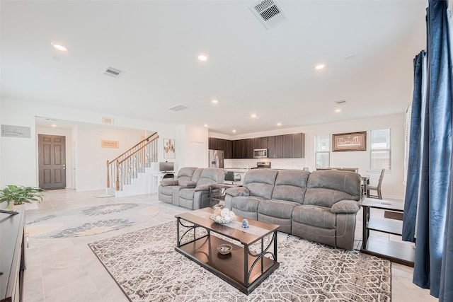 6831 Beck Canyon Dr, Houston, TX 77084 - living room featuring stairs and recessed lighting