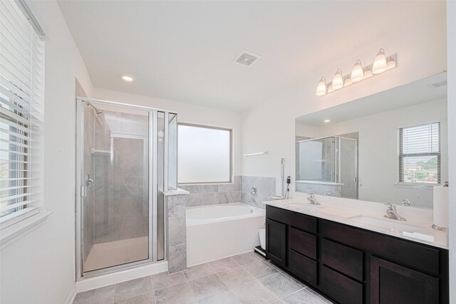 6831 Beck Canyon Dr, Houston, TX 77084 - bathroom with double vanity, a bath, a shower stall, and recessed lighting