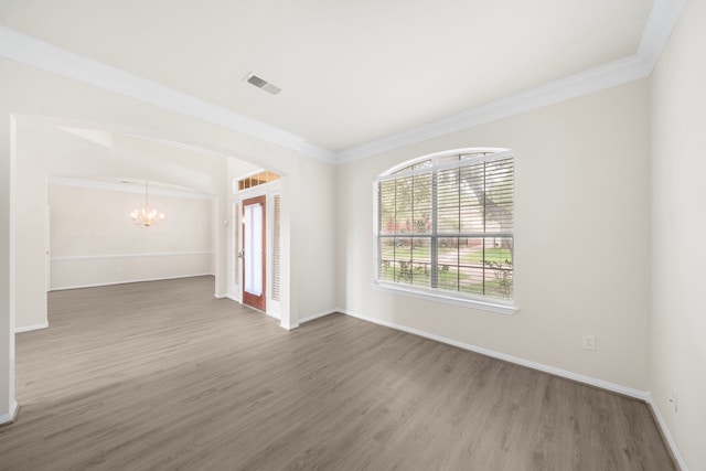 18231 Emerald Stone Ln, Houston, TX 77094 - unfurnished room featuring a chandelier, wood finished floors, crown molding, and baseboards