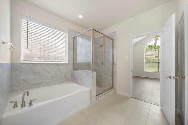 18231 Emerald Stone Ln, Houston, TX 77094 - full bath featuring a bath, a shower stall, and tile patterned flooring
