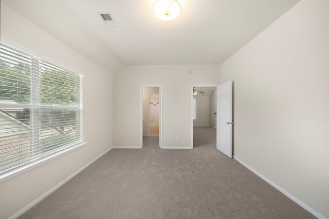 18231 Emerald Stone Ln, Houston, TX 77094 - unfurnished bedroom featuring multiple windows, carpet floors, and baseboards