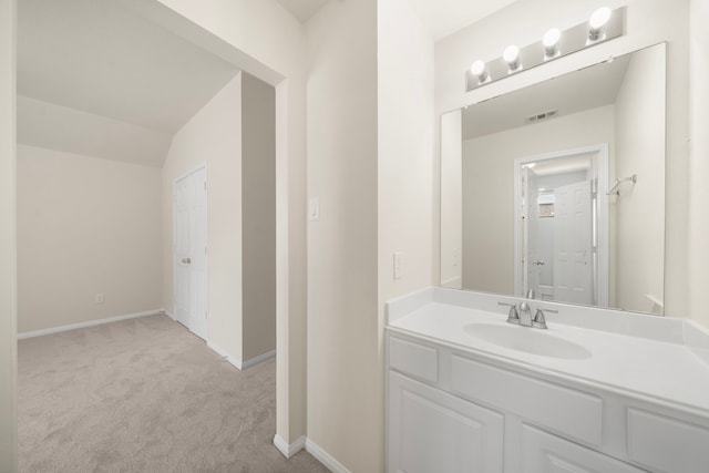 18231 Emerald Stone Ln, Houston, TX 77094 - bathroom featuring baseboards, vaulted ceiling, and vanity