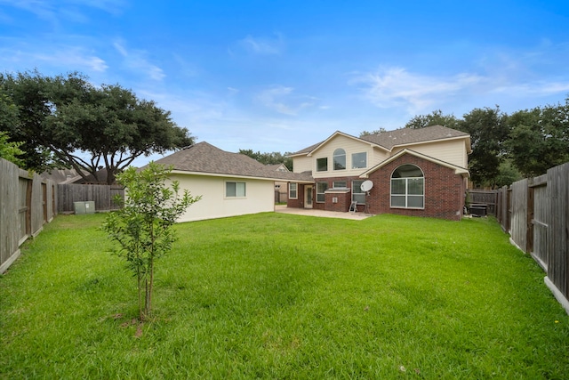 18231 Emerald Stone Ln, Houston, TX 77094 - rear view of house featuring a patio and brick siding