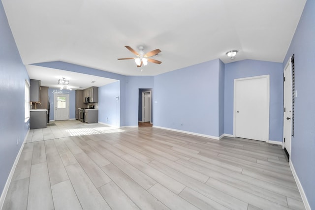 2323 Chalet Rd, Houston, TX 77038 - unfurnished living room with ceiling fan, light wood-style floors, and baseboards