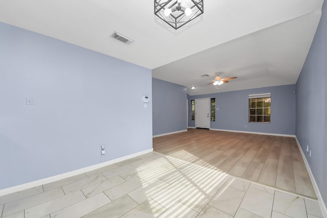 2323 Chalet Rd, Houston, TX 77038 - spare room featuring baseboards, a ceiling fan, lofted ceiling, and light wood-type flooring