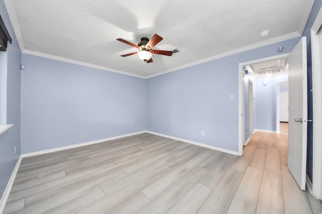 2323 Chalet Rd, Houston, TX 77038 - spare room with ceiling fan, attic access, light wood-type flooring, baseboards, and ornamental molding