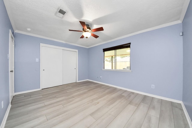 2323 Chalet Rd, Houston, TX 77038 - unfurnished bedroom with wood finished floors, a closet, baseboards, a ceiling fan, and ornamental molding