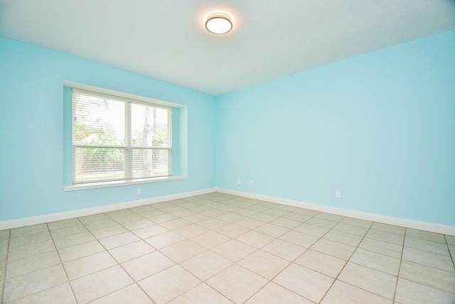1307 Remington Crest Dr, Houston, TX 77094 - spare room featuring baseboards and light tile patterned floors