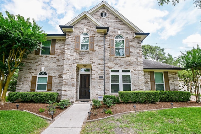 1307 Remington Crest Dr, Houston, TX 77094 - view of front of home featuring brick siding and a front yard