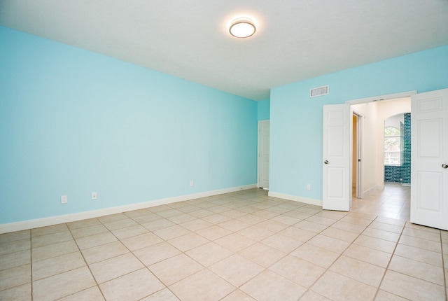 1307 Remington Crest Dr, Houston, TX 77094 - empty room with baseboards and light tile patterned flooring