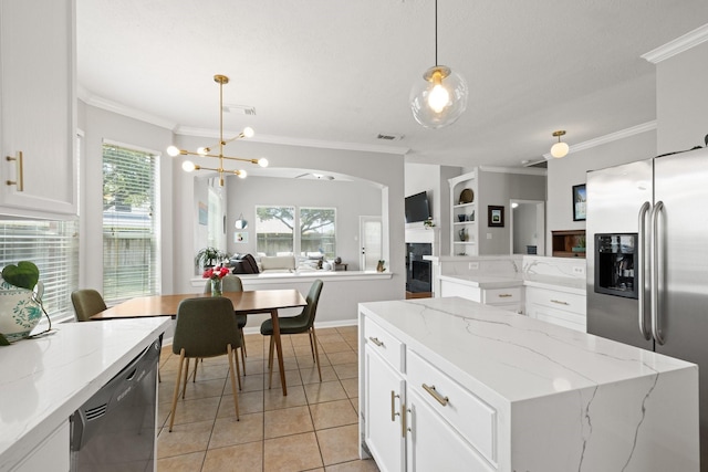 12002 Iris Canyon Dr, Tomball, TX 77377 - kitchen with stainless steel fridge, dishwashing machine, ornamental molding, light tile patterned flooring, and decorative light fixtures