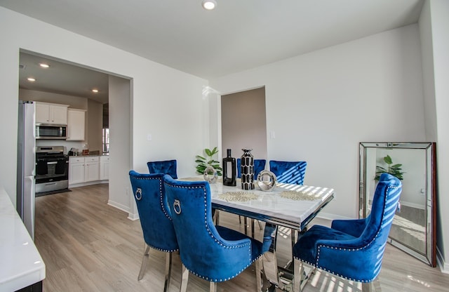 3121 Freeboard Dr, Texas City, TX 77510 - dining room featuring light wood-style floors, recessed lighting, and baseboards