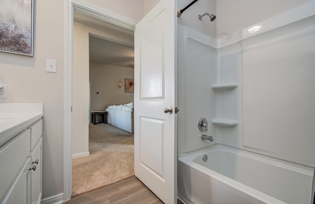 3121 Freeboard Dr, Texas City, TX 77510 - bathroom featuring wood finished floors, vanity, and shower / bath combination
